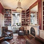 Custom bookcases showing illuminated drinks cabinet